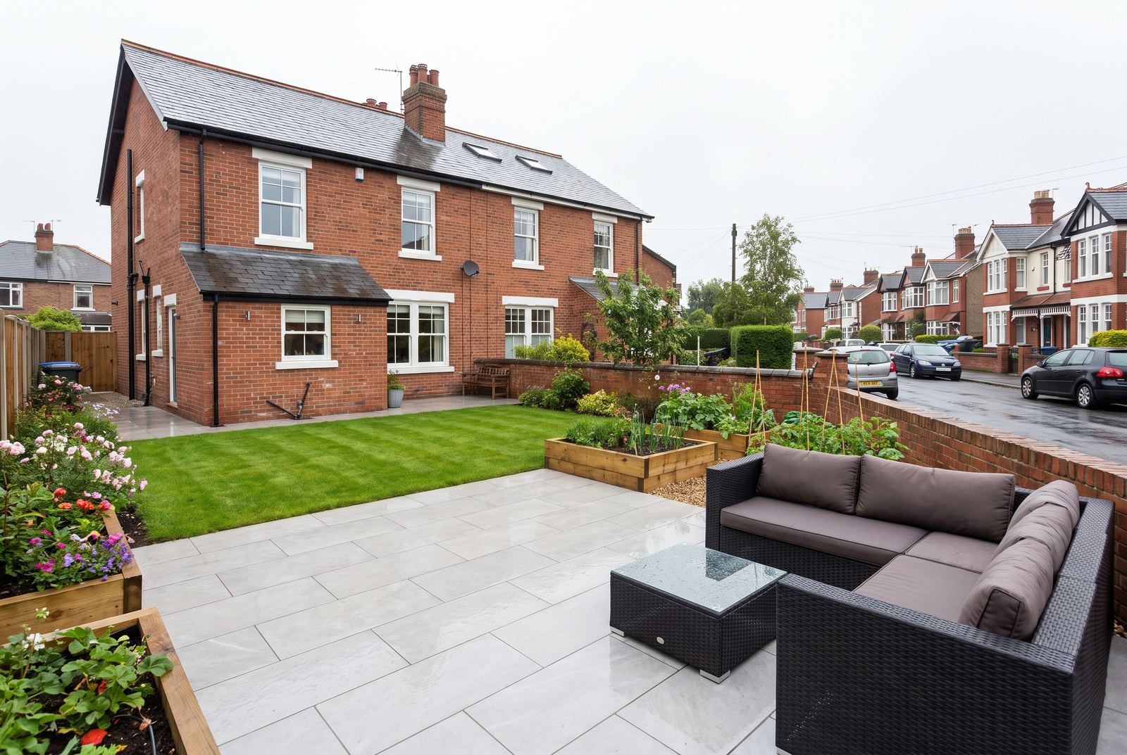 A large format grey porcelain patio in a British back garden